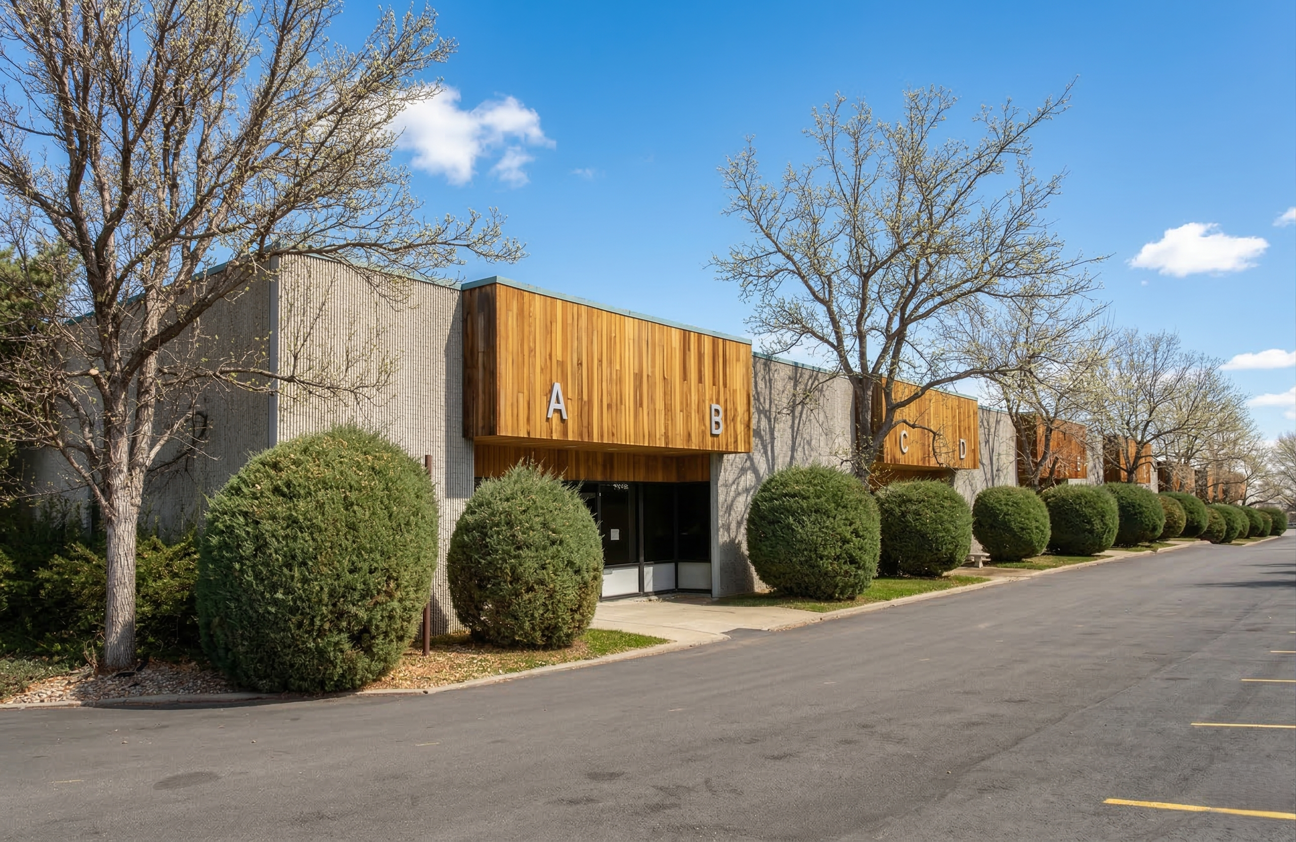Park West Business Center — small-bay industrial with cedar-clad entries, Lakewood, Colorado